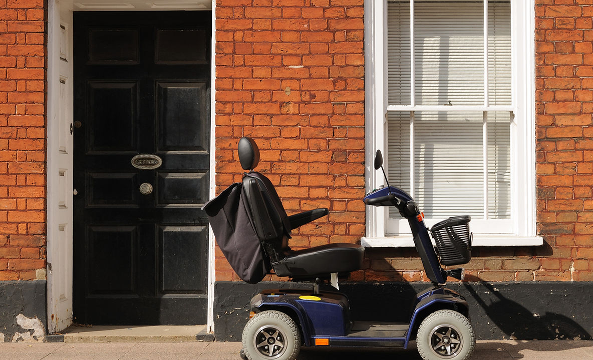 Mobility scooter parked outside a house
