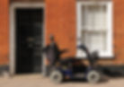 Mobility scooter parked outside a house