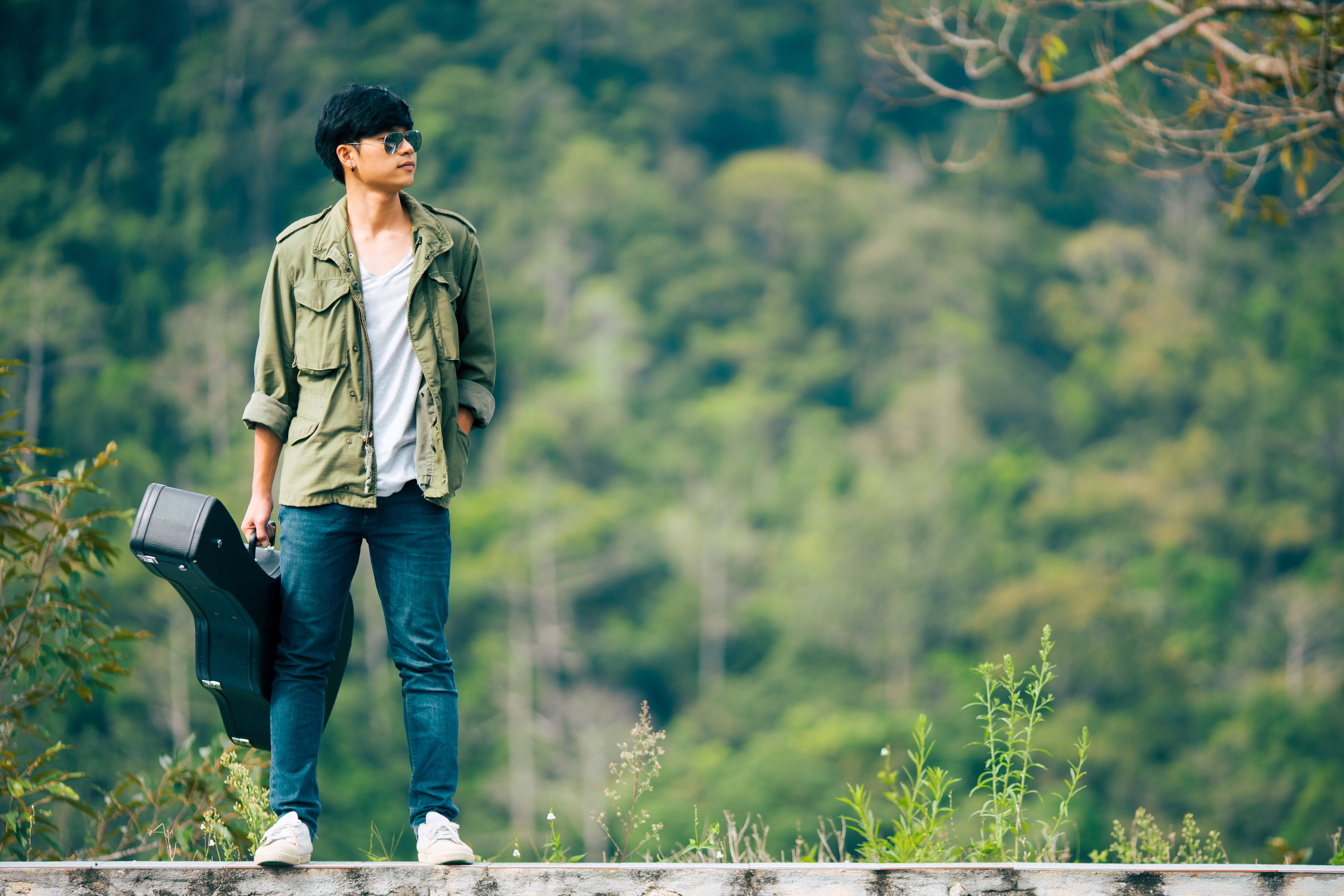 Person Holding Guitar Case