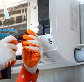 Hands Repairing Air Conditioner