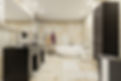 Modern bathroom with beige tiled walls, a freestanding oval bathtub, dual sinks on a dark vanity