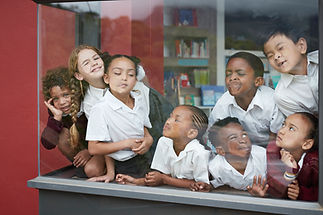 Faces Against Window