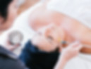 a facial client receiving facial treatment at the facial room