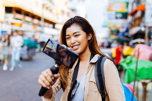 Female tourist taking photos while traveling
