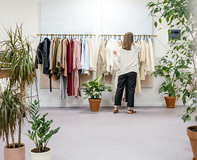 a girl working in a clothing store
