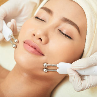 Asian woman getting a facial treatment at a spa