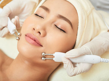 Asian woman getting a facial treatment at a spa