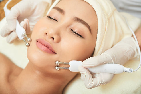 Asian woman getting a facial treatment at a spa