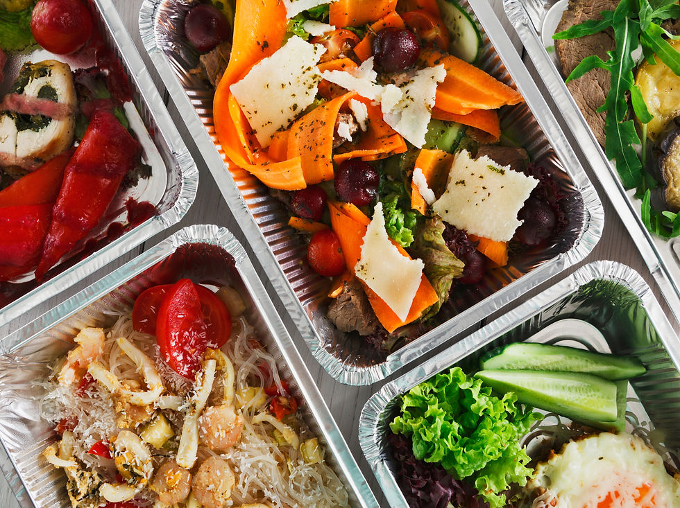 Colourful array of gourmet meals in foil containers