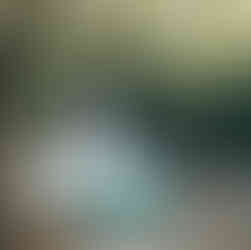 The powerful Banias Waterfall cascading into a turquoise pool surrounded by dense green forest.