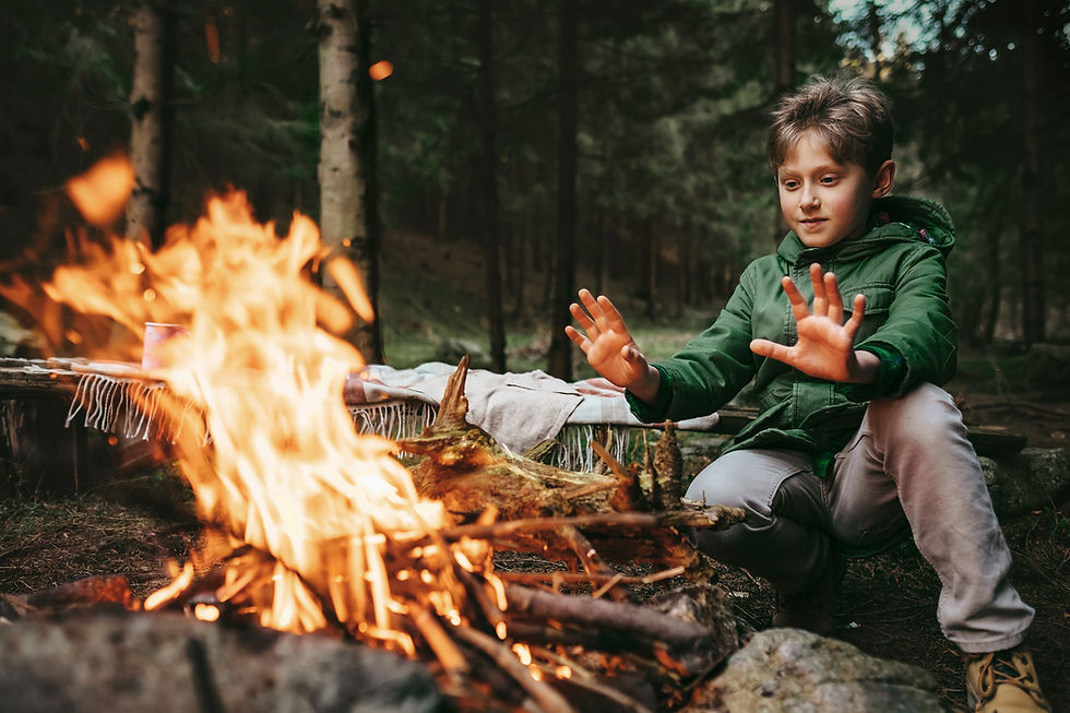 Boy by Campfire