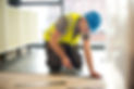 A Worker carefully installing rubber flooring