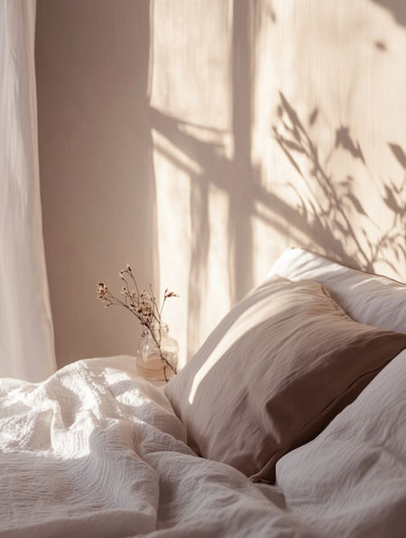 A cozy bedroom setup with light coming through window