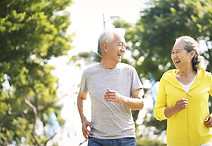 Elderly Couple Running Together