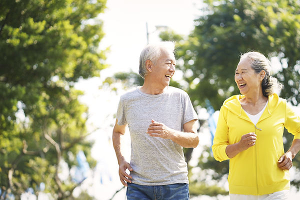 Elderly Couple Running Together