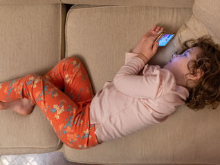 Child struggling to stop screen time due to dopamine stimulation