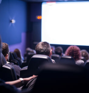 Cinema experience in Munich. A person watching a film in a modern theatre