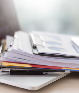 Laptop and Paperwork