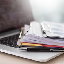 Laptop and Paperwork