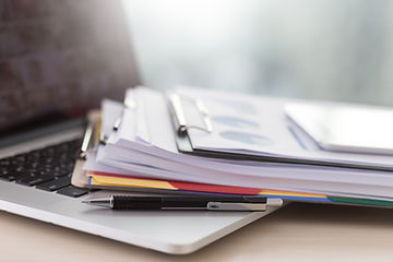Laptop and Paperwork