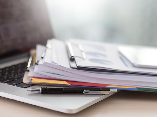 Laptop and Paperwork