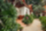 A walking path in front of a bungalow