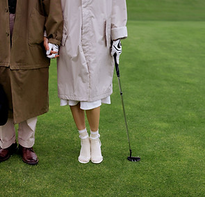 Golf Players Holding Hands