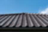 The roof of a house covered with a new ceramic tile, visible ceramic ventilation tile