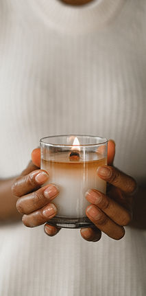 Hands holding candle