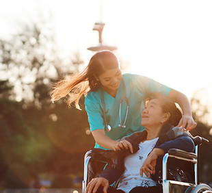 A nurse taking card of old patient