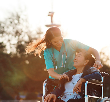 A nurse taking card of old patient
