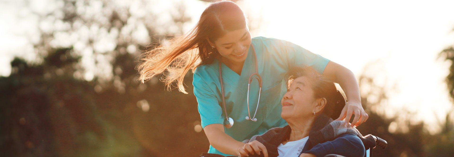 A nurse taking card of old patient
