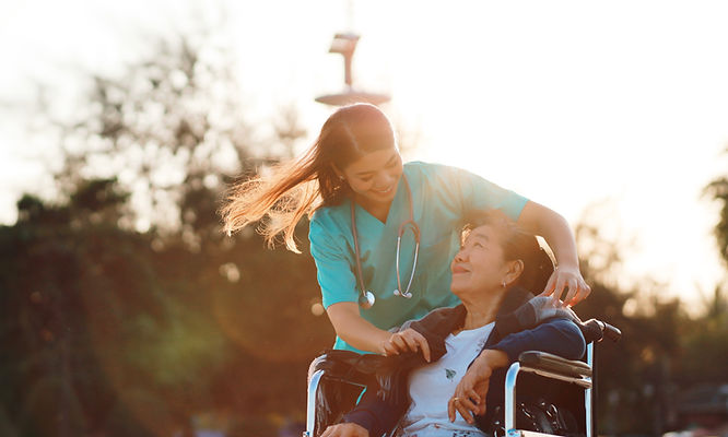 A nurse taking card of old patient