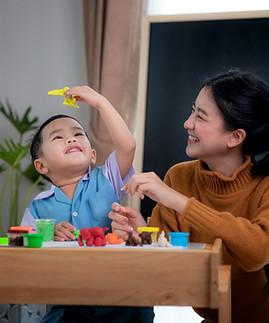 Mom And Baby Playing Together With Toys