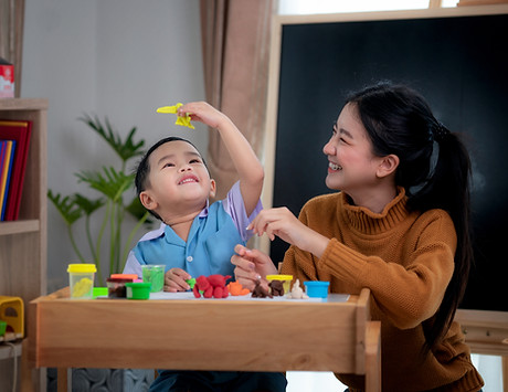 Mom And Baby Playing Together With Toys