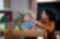 Mom And Baby Playing Together With Toys