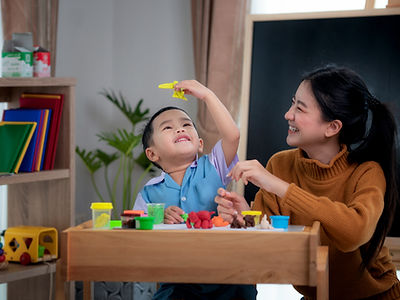 Mom And Baby Playing Together With Toys