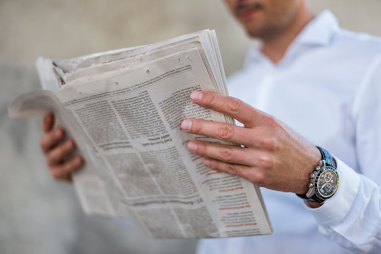 Man Reading Newspaper