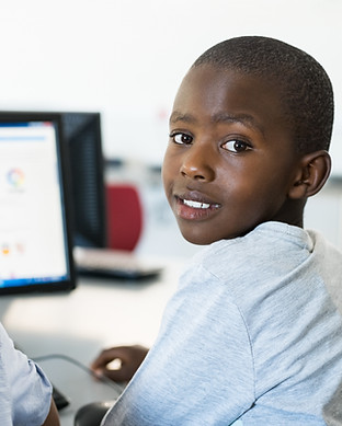 Child learning through his computer.