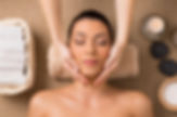 Beautiful Latin Woman Getting Facial Massage At Spa