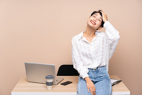 Young Asian businesswoman at her workplace