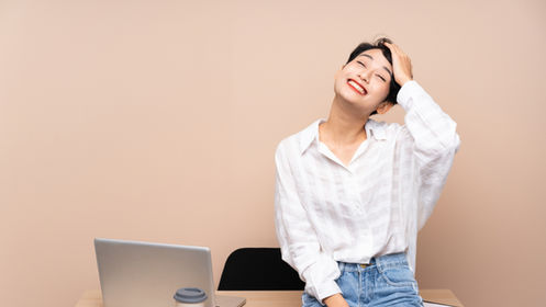 Young Asian businesswoman at her workplace
