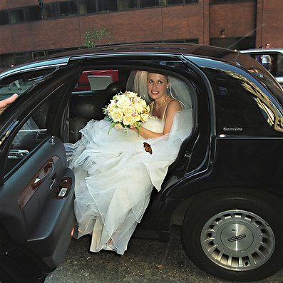 a bride exiting the black car