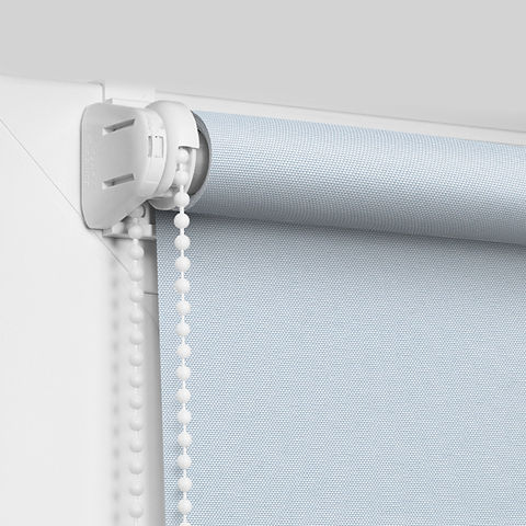 Color blackout roller blind on the white plastic window