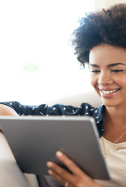 smiling woman using tablet