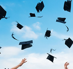 Graduation Hats Flying
