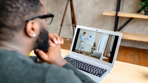Man looking at computer, during an online course