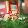 Child Reading Outdoors