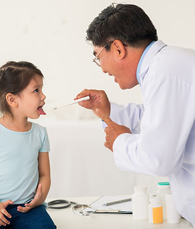 Asian doctor performing a general health screening for kid
