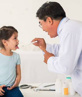 Asian doctor performing a general health screening for kid